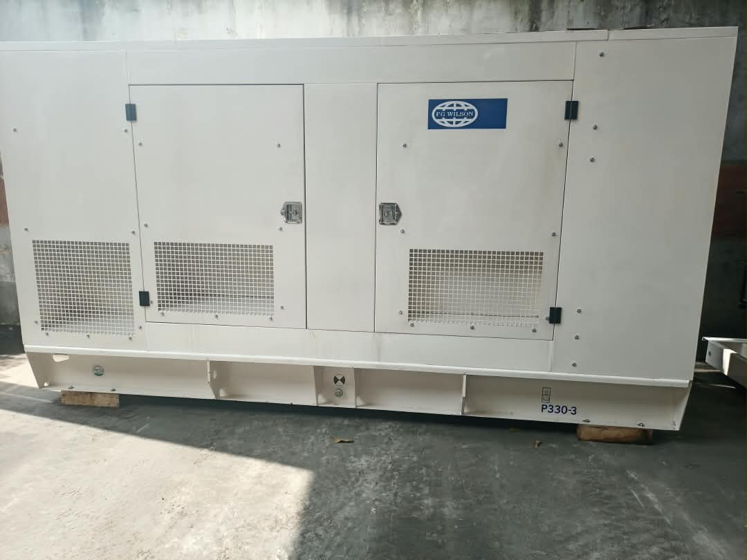 FG Wilson P330 300 kVA diesel generator in a large white soundproof canopy